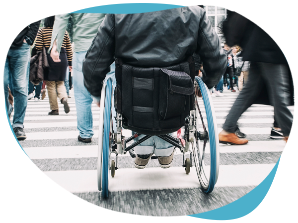Personalized Disability Resources-Man in wheelchair going against crowd